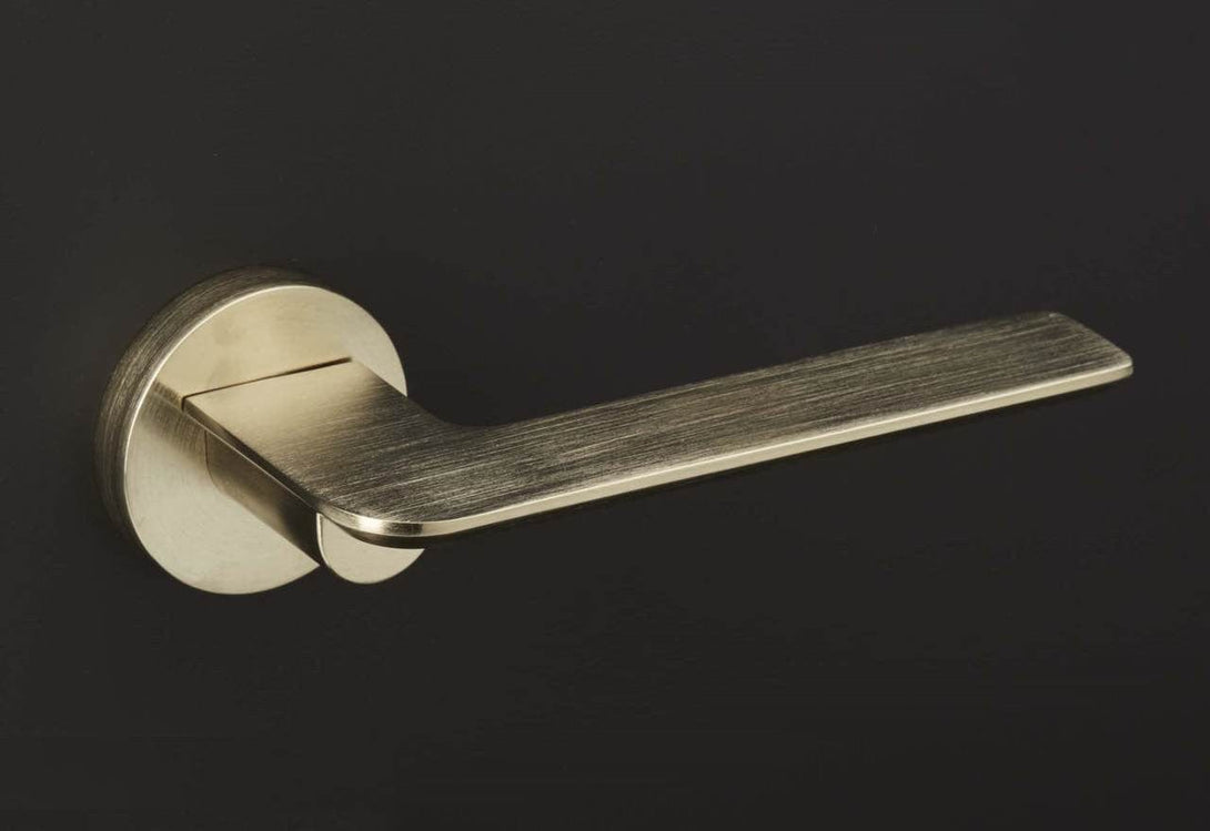 brass door handle mucheln edge on black
