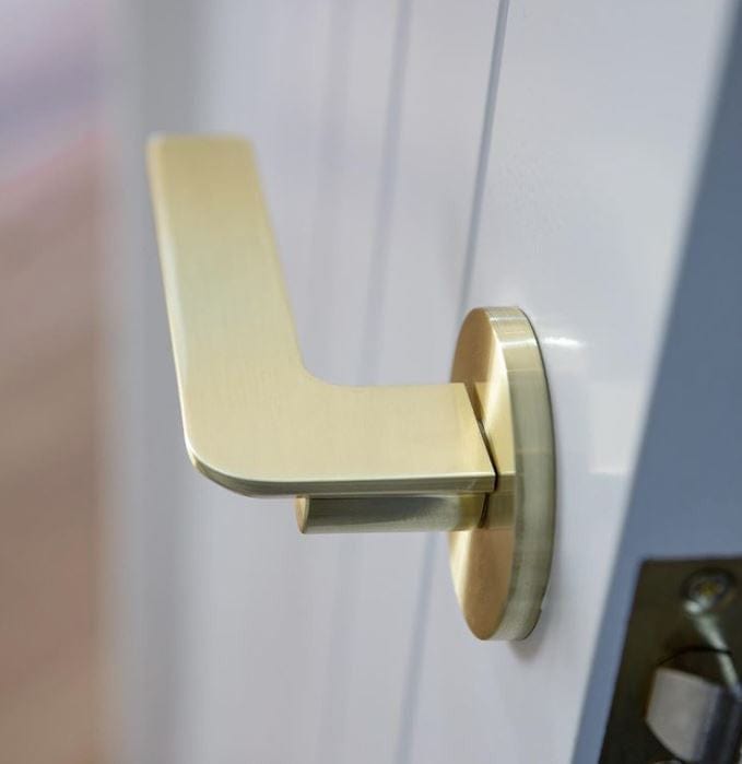 brushed brass edge handle on door